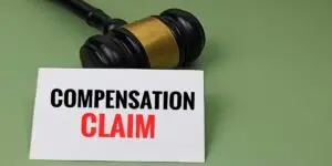 Compensation Claim Concept with Judge Gavel Representing Legal Proceedings, Financial Settlement, Liability, and Court Decision. used in Pharmacy Medication Error Lawyer in Tennessee