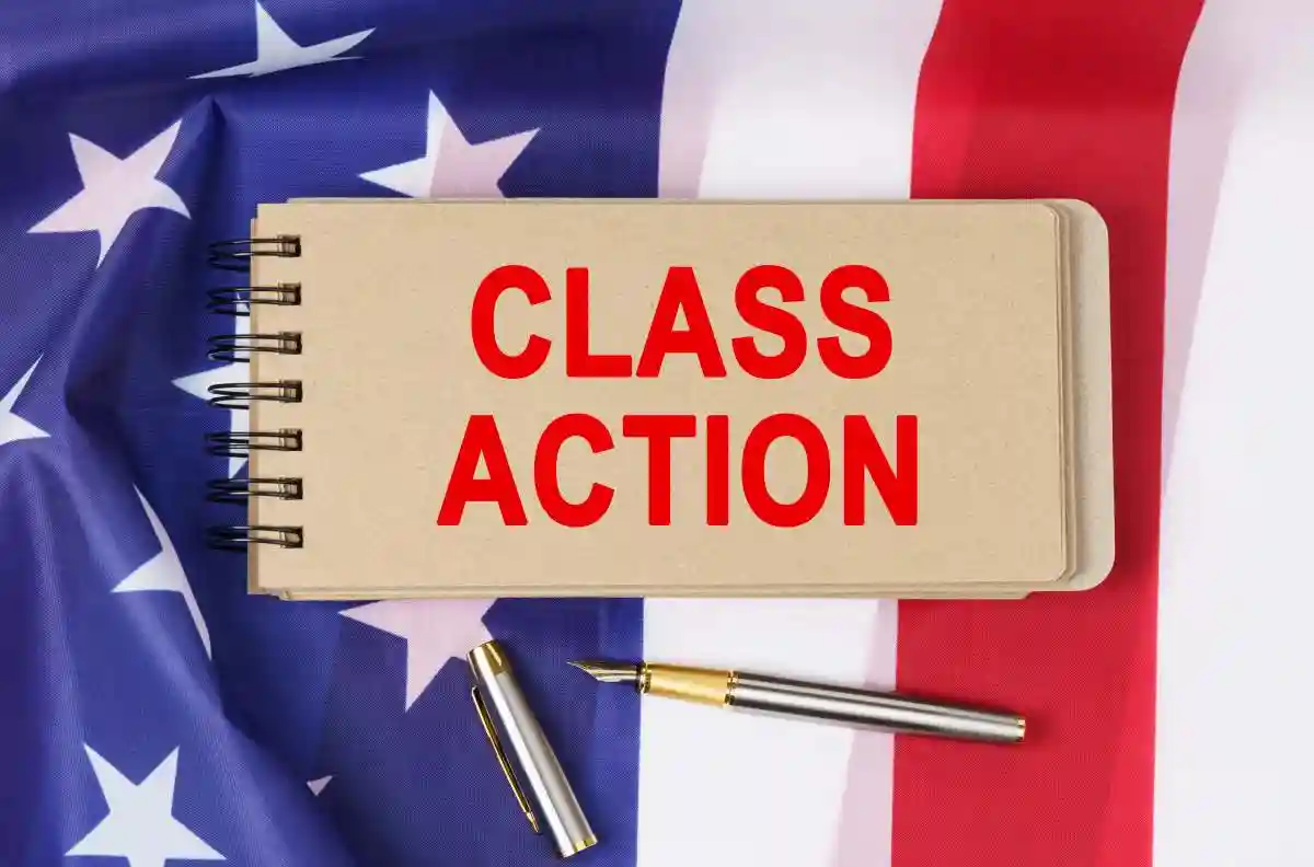 Law and order concept. Against the background of the flag of the United States of America lies a notebook with the inscription - CLASS ACTION USED IN Securities Class Actions and Class Certification