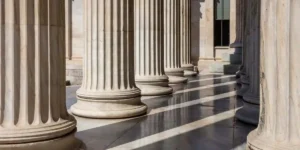 Classic columns pillars white marble. Athens Greece Academy neoclassical building entrance colonnade. Classical pillars in a row. used in Primoris class action lawsuit