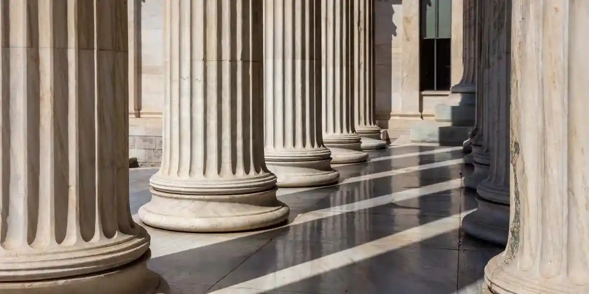 Classic columns pillars white marble. Athens Greece Academy neoclassical building entrance colonnade. Classical pillars in a row.
used in Primoris class action lawsuit 
