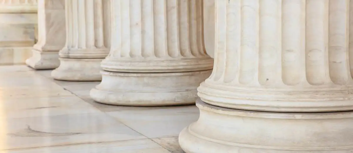 Classical marble pillars detail on the facade of a building
used in Primoris class action lawsuit 